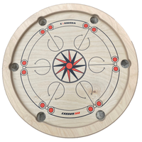 Bovenaanzicht van het lege Carrooka Carrom360 draaibord met ster in het midden en zes pockets